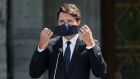Justin Trudeau, Canada's prime minister, puts on his mask before leaving a news conference in Ottawa, Ontario, Canada, on Sunday, Aug. 15, 2021. Trudeau called an election for next month, seeking to capitalize on polls showing his Liberal Party with a large enough lead to retake a majority in parliament.