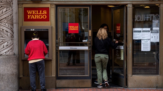 A customer uses an automated teller machine (ATM) at a Wells Fargo bank branch in San Francisco, California, U.S., on Monday, July 12, 2021. Wells Fargo & Co. is expected to release earnings figures on July 14. Photographer: David Paul Morris/Bloomberg