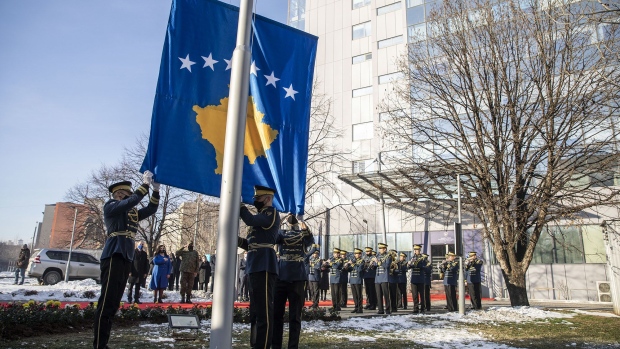 PRISTINA, KOSOVO - FEBRUARY 17: Soldiers of the National Guard rise the kosovar flag during the ceremony in the garden of the Government building on February 17, 2021 in Pristina, Kosovo. A decade after the 1998-99 war between ethnic Albanian rebels and Serbian forces, Kosovo declared independence from Serbia on February 17, 2008. Whilst tensions between Serbia and Kosovo are still of concern for the neighbouring Balkan countries, the recent elections have given voice to the next generation with the leftist movement VetÎvendosje. (Photo by Ferdi Limani/Getty Images)