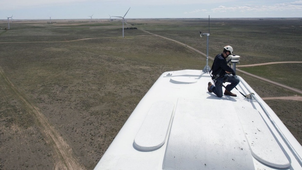A General Electric Co. renewable energy technician works on a turbine at the Colorado Highlands Wind Farm in Fleming, Colorado.