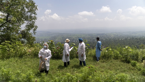 A 'door-to-door' Covid-19 vaccination team surveys the area during a vaccination drive at a village in the Budgam district of Jammu and Kashmir, India.