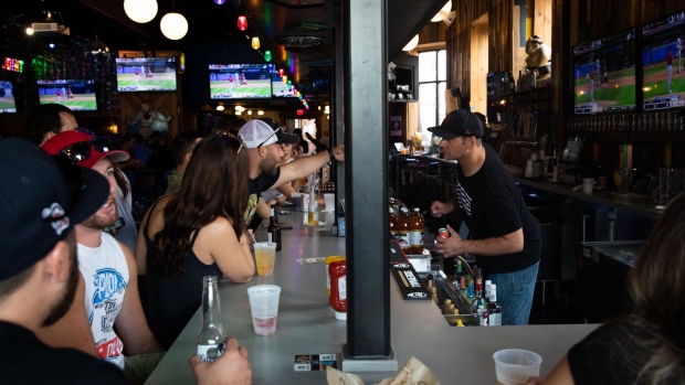 Customers at a bar in Detroit, Michigan, U.S., on Sunday, Aug. 8, 2021. The number of people in Michigan hospitalized with confirmed or probable Covid-19 illnesses nearly doubled over the past 10 days, ABC12 News reports.