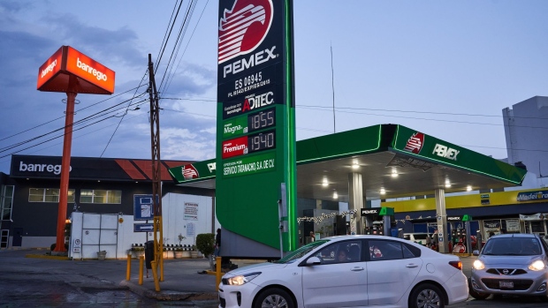 Vehicles pass in front of a Petroleos Mexicanos (Pemex) gas station in San Luis Potosi, Mexico, on Tuesday, Jan. 19, 2021. Mexican President Andres Manuel Lopez Obrador has sought to clamp down on private competition to state-owned companies, saying in October he intends to protect the interests of state oil producer Petroleos Mexicanos and electricity firm Comision Federal de Electricidad. At the time, he accused foreign companies of ransacking the country.