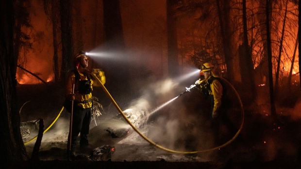 Firefighters battle flames during the Caldor Fire in Kyburz, California, on Aug. 21.