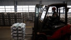 A worker operates a forklift to transport bound stacks of aluminium ingots ready for shipping in the foundry at the Khakas aluminium smelter, operated by United Co. Rusal, in Sayanogorsk, Russia, on Wednesday, May 26, 2021. United Co. Rusal International PJSC’s parent said the company has produced aluminum with the lowest carbon footprint as the race for cleaner sources of the metal intensifies. Photographer: Andrey Rudakov/Bloomberg
