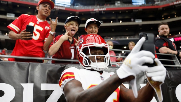Wide receiver Byron Pringle #13 of the Kansas City Chiefs poses for selfies with fans before the NFL preseason game against the Arizona Cardinals at State Farm Stadium in Glendale, Arizona on Aug. 20. 