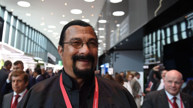 Steven Seagal, Russia's special representative for Russian-U.S. humanitarian ties, walks through the main hall after attending the plenary session with Vladimir Putin, Russia’s president, and Xi Jinping, China's president, at the St. Petersburg International Economic Forum (SPIEF) in St. Petersburg, Russia, on Friday, June 7, 2019. Over the last 21 years, the Forum has become a leading global platform for members of the business community to meet and discuss the key economic issues facing Russia, emerging markets, and the world as a whole.