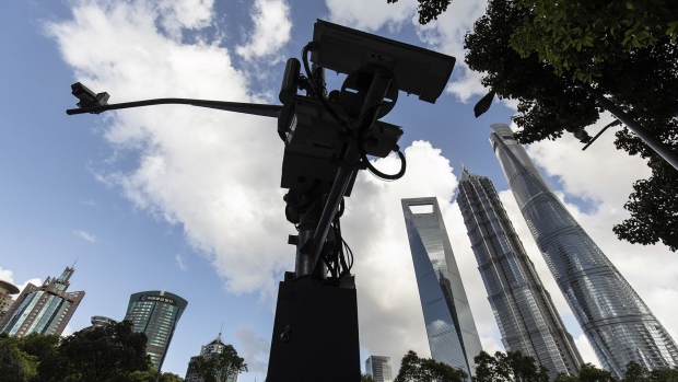Surveillance cameras in the Lujiazui business district in Shanghai, China, on Tuesday, July 20, 2021. Banks in China kept the benchmark loan rate unchanged, indicating that the central bank is continuing to keep policy stable despite a recent surprise move to add liquidity to the financial system.