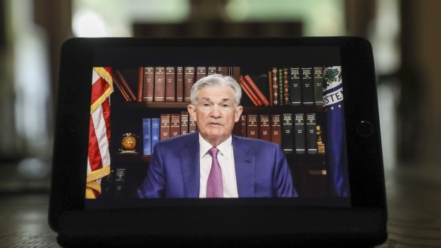 Jerome Powell, chairman of the U.S. Federal Reserve, speaks virtually during the Jackson Hole economic symposium in Tiskilwa, Illinois, U.S., on Friday, Aug. 27, 2021. Powell said the central bank could begin reducing its monthly bond purchases this year, though it won't be in a hurry to begin raising interest rates thereafter. Photographer: Daniel Acker/Bloomberg