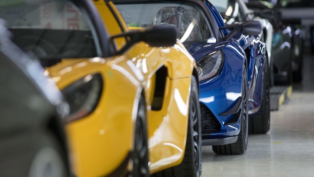 Finished Lotus sports cars sit on the inspection line at the Group Lotus Plc in Hethel Photographer: Simon Dawson/Bloomberg