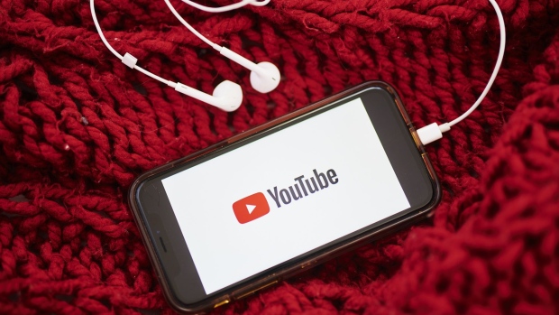 The logo for YouTube Inc. is displayed on a smartphone in an arranged photograph taken in the Brooklyn borough of New York, U.S., on Sunday, May 10, 2020. The video arm of Alphabet Inc.'s Google is offering new tools and audience statistics specifically for advertising on TV - screen space where YouTube has trailed cable channel. Photographer: Gabby Jones/Bloomberg
