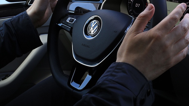 A driver removes his hands from the steering wheel while demonstrating the semi-autonomous driving system in a new Volkswagen Arteon automobile, manufactured by Volkswagen AG (VW), in Hannover, Germany, on Wednesday, May 31, 2017. Porsche Automobil Holding SE denied it misled investors about emissions cheating at its biggest asset VW, as the holding company\'s board members battle lawsuits and investigations tied to the carmaker\'s diesel scandal. Photographer: Krisztian Bocsi/Bloomberg
