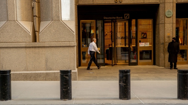 A Deutsche bank employee entering to the bank at Wall Street in early morning.New York U.S., on Monday ,May 12, 2021. Photographer: Amir Hamja/Bloomberg