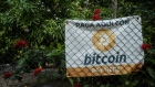 Bitcoin signage outside a shop in El Zonte, El Salvador, on Monday, June 14, 2021. Photographer: Cristina Baussan/Bloomberg