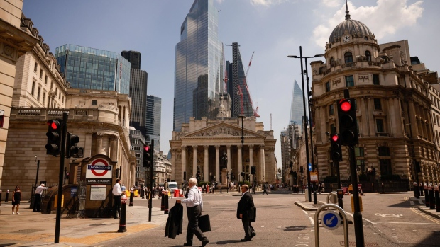 Pedestrians walk near the Bank of England, on so-called 'Freedom Day', in the City of London, U.K., on Monday, July 19, 2021. Boris Johnson's plan to get the U.K. back to normal is in disarray, with Covid-19 cases rising the most in the world and a public outcry over the prime minister's perceived attempt to dodge isolation rules. Photographer: Jason Alden/Bloomberg