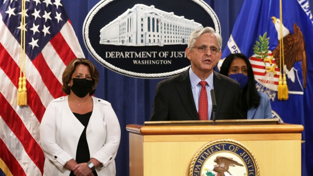 U.S. Attorney General Merrick Garland (2nd L) speaks as Deputy Attorney General Lisa Monaco (L) and Associate Attorney General Vanita Gupta (R) listen during a news conference to announce a civil enforcement action at the Department of Justice on September 9, 2021 in Washington, DC. 