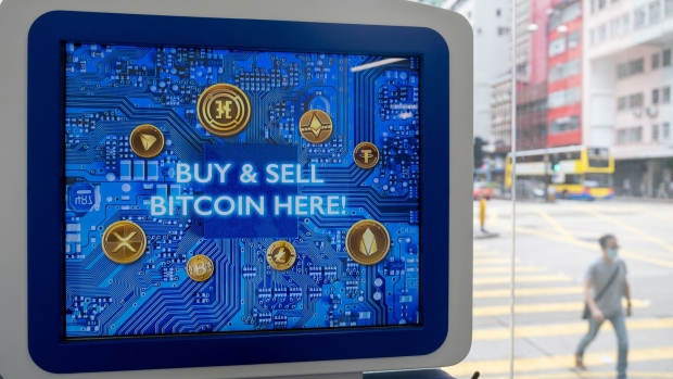 A screen reading "Buy and sell Bitcoin here!" on a cryptocurrency automated teller machine (ATM) at the Hong Kong Digital Asset Exchange Ltd. digital currency trading store in Hong Kong, China, on Thursday, June 24, 2021. Hong Kong Digital Asset Exchange is a cryptocurrency platform and is the first to combine online and physical exchange in Hong Kong. Photographer: Paul Yeung/Bloomberg