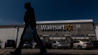 A shopper carries a bag outside a Walmart store in San Leandro, California, U.S., on Thursday, May 13, 2021. Walmart Inc. is expected to release earnings figures on May 18. Photographer: David Paul Morris/Bloomberg