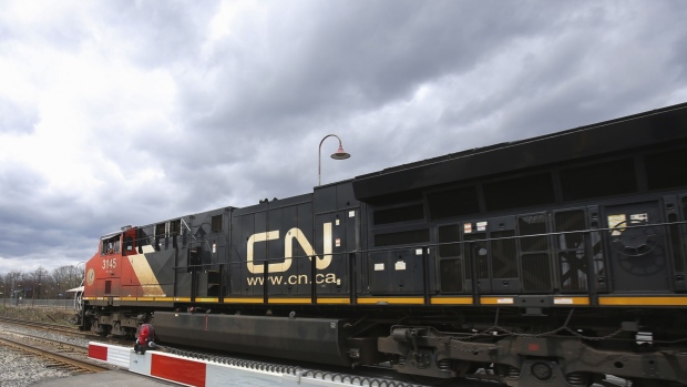 A Canadian National Railway locomotive pulls a train in Montreal, Quebec, Canada, on Tuesday, April 20, 2021. Canadian National Railway Co. offered $30 billion to snatch Kansas City Southern away from a rival, spurring a possible bidding war over one of the industrys biggest deals in decades.
