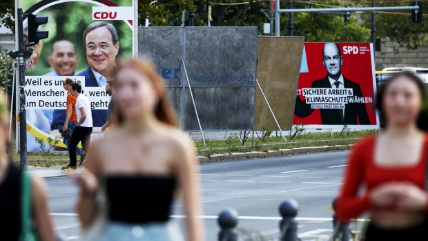 Election campaign posters featuring Armin Laschet, chancellor candidate for the Christian Democratic Union (CDU), left, and Olaf Scholz, chancellor candidate for the Social Democratic Party (SPD), in Berlin, Germany, on Monday, Aug. 16, 2021. In six weeks, Germany will elect a new leader after 16 years under Chancellor Angela Merkel.