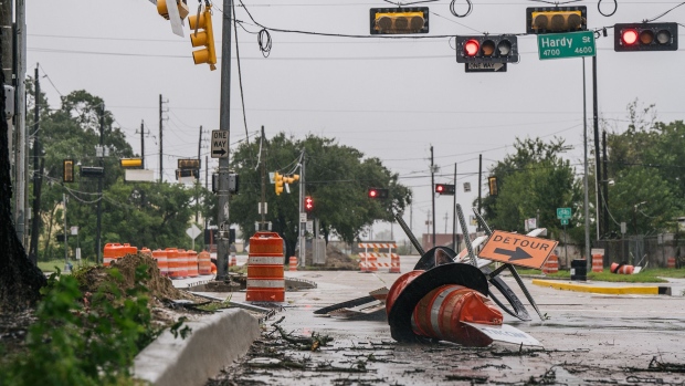 Debris and damaged road construction are left after Tropical Storm Nicholas moved through the area on September 14, 2021 in Houston, Texas.