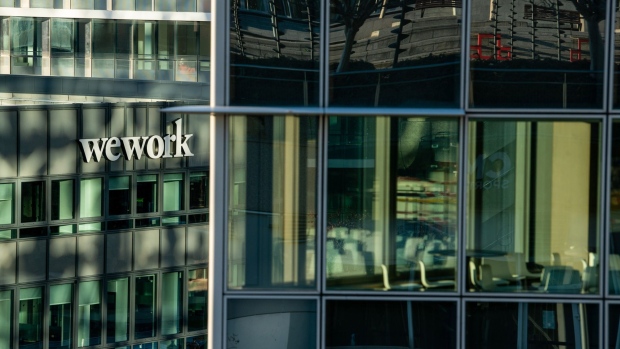 The Wework logo outside a WeWork co-working office space in the La Defense business district of Paris, France, on Monday, Nov. 9, 2020. France's economy will take a smaller hit from the new lockdown to contain the spread of Covid-19 than it did during the tighter restrictions on activity earlier this year, according to the country’s central bank.