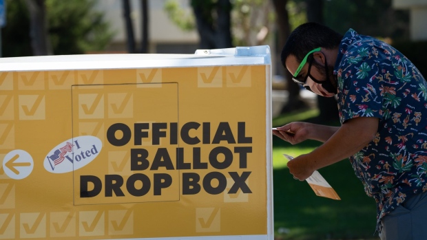 A voter drops off a ballot at the Orange County Registrar of Voters during the gubernatorial recall election in Santa Ana, California, on Tuesday, Sept. 14, 2021. Californians are heading to the polls Tuesday to decide whether to oust Gavin Newsom in only the second gubernatorial recall election in state history.