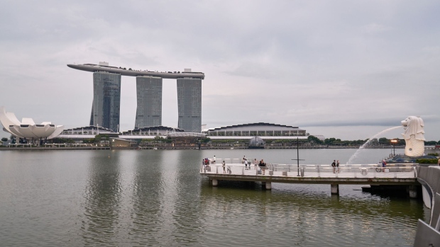 The Marina Bay Sands beyond Merlion Park in the central business district of Singapore, on Wednesday, May 19, 2021. In the financial mecca of Singapore, technology companies have been steadily growing their footprint in recent years, chipping away at the dominance of banks in the island-state's central business district. Photographer: Lauryn Ishak/Bloomberg