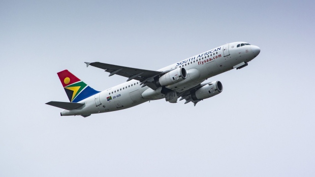 Passenger jets, operated by South African Airlines (SAA), taxi at O.R. Tambo International Airport in Johannesburg. Photographer: Waldo Swiegers/Bloomberg