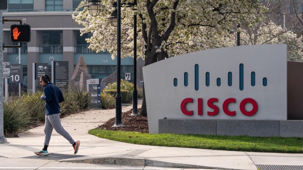 A runner jogs past Cisco Systems headquarters in San Jose, California, U.S., on Monday, Feb. 8, 2021. Cisco Systems Inc. is scheduled to release earnings figures on February 9.