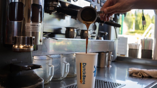 A barista pours a shot of espresso while preparing a drink at a Dutch Bros. Coffee location in Beaverton, Oregon, U.S., on Thursday, June 24, 2021. Dutch Bros. The privately-held chain has recently filed confidentially for an initial public offering.