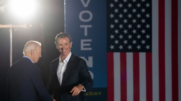 U.S. President Joe Biden, left, shakes hands with Gavin Newsom, governor of California, during a campaign event at Long Beach City College in Long Beach, California, on Sept. 13.