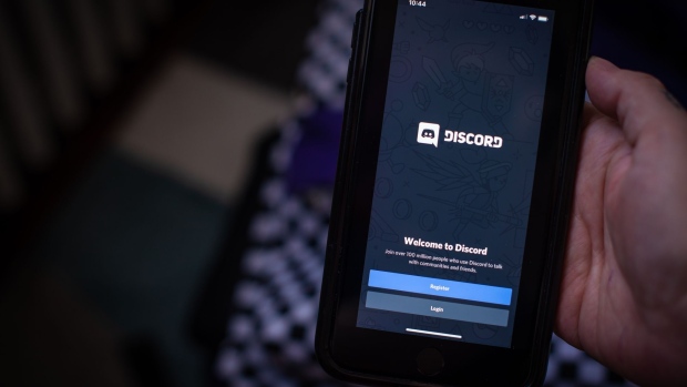 The Discord Inc. application on a smartphone arranged in Hastings-on-Hudson, New York, on Tuesday, March 23, 2021. Microsoft Corp. is in talks to acquire Discord Inc., a video-game chat community, for more than $10 billion, according to people familiar with the matter. Photographer: Tiffany Hagler-Geard/Bloomberg