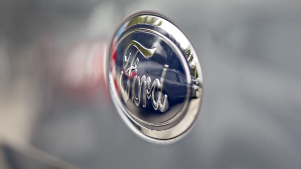 A Ford Motor Co. badge is seen on a vehicle displayed at a car dealership in Orland Park, Illinois, U.S., on Friday, Sept. 27, 2019. Auto sales in the U.S. probably took a big step back in September, setting the stage for hefty incentive spending by carmakers struggling to clear old models from dealers' inventory. Photographer: Daniel Acker/Bloomberg