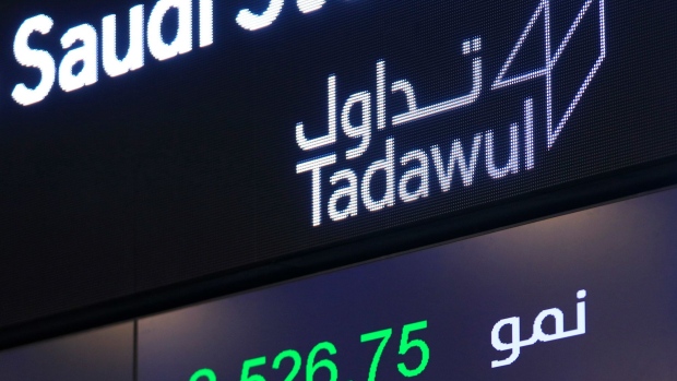 Stock price movements sit on a digital display board at the Saudi Stock Exchange, also known as Tadawul, in Riyadh, Saudi Arabia, on Sunday, Nov. 4, 2018. Photographer: Mohammed Almuaalemi/Bloomberg