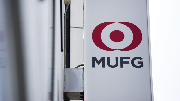 The logo of Mitsubishi UFJ Financial Group Inc. (MUFG) is displayed on a sign outside a Bank of Tokyo-Mitsubishi UFJ Ltd. branch in Tokyo, Japan, on Thursday, May 11, 2017. MUFG is scheduled to release full-year earnings figures on May 15. Photographer: Tomohiro Ohsumi/Bloomberg