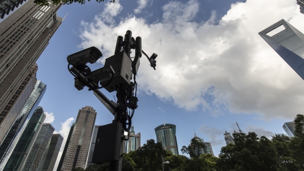 Surveillance cameras in the Lujiazui business district in Shanghai, China, on Tuesday, July 20, 2021. Banks in China kept the benchmark loan rate unchanged, indicating that the central bank is continuing to keep policy stable despite a recent surprise move to add liquidity to the financial system. Photographer: Qilai Shen/Bloomberg