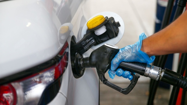 A man fills his car with petrol at a Esso petrol and refueling station in London, U.K., on Thursday, June 17, 2021. U.K. Chancellor of the Exchequer Rishi Sunak said rising prices are one of his near-term concerns, as U.K. inflation surged unexpectedly past the Bank of Englands target for the first time in almost two years. Photographer: Hollie Adams/Bloomberg