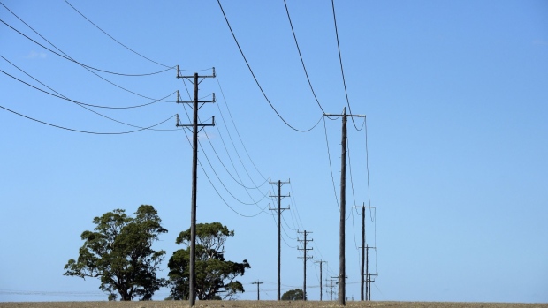 Power lines stretch across farmland in the Latrobe Valley, Australia, on Saturday, Feb. 23, 2019. Australian Prime Minister Scott Morrison is pledging A$2 billion ($1.4 billion) over the next 10 years in direct action to lower greenhouse gas emissions, making a climate pitch to voters ahead of elections due by May. Photographer: Carla Gottgens/Bloomberg