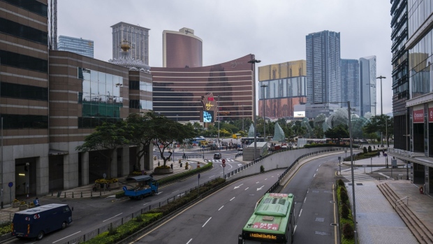 Vehicles travel past the Wynn Macau casino resort, operated by Wynn Resorts Ltd., center left, and the MGM Cotai casino resort, developed by MGM China Holdings Ltd., center right, in Macau, China, on Wednesday, Feb. 5, 2020. Casinos in Macau, the Chinese territory that's the world's biggest gambling hub, closed for 15 days as China tries to contain the spread of the deadly coronavirus. Photographer: Justin Chin/Bloomberg