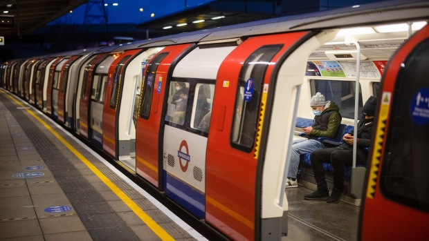 Commuters sit on a Jubilee line tube train at Canning Town Station in London, U.K., on Wednesday, Jan. 20, 2021. Data shows Britons are far more active during the current third national lockdown than when the first emergency "stay at home" order was given last spring. Photographer: Simon Dawson/Bloomberg