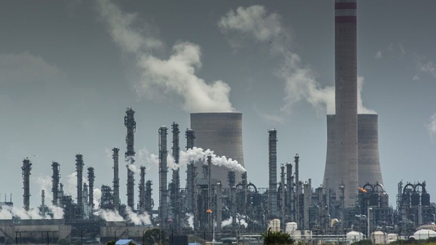 Emissions rise from towers of the Sasol Ltd. Secunda coal-to-liquids plant in Mpumalanga, South Africa, on Monday, Dec. 23, 2019. The level of sulfur dioxide emissions in the Kriel area in Mpumalanga province only lags the Norilsk Nickel metal complex in the Russian town of Norilsk, the environmental group Greenpeace said in a statement, citing 2018 data from NASA satellites. Photographer: Waldo Swiegers/Bloomberg