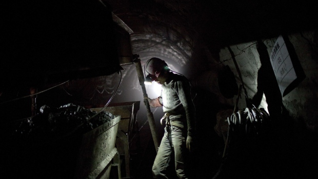 A worker labors to develop a new coal mine shaft in Shanxi Province, China.
