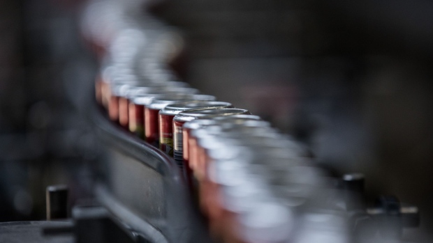 Aluminium cans of Coke soda move along the automated production line at the Coca-Cola Hbc Magyarorszag Kft plant in Dunaharaszti, Hungary, on Thursday, July 13, 2017. Coca-Cola is pushing to expand its non-soda offerings, but carbonated soft drinks still make up the majority of sales. Photographer: Akos Stiller/Bloomberg