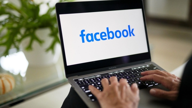 The logo for Facebook is displayed on a laptop computer in an arranged photograph taken in Little Falls, New Jersey, U.S., on Wednesday, Oct. 7, 2020. Facebook Inc. is tightening its rules on content concerning the U.S. presidential election next month, including instituting a temporary ban on political ads when voting ends, as it braces for a contentious night that may not end with a definitive winner. Photographer: Gabby Jones/Bloomberg