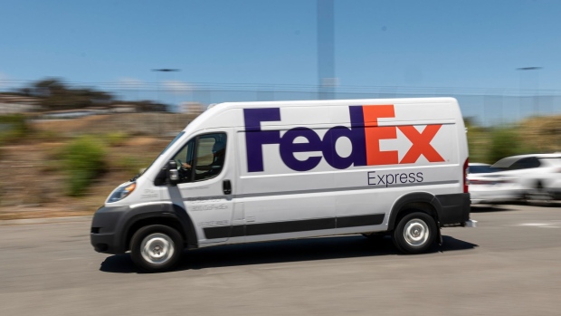 A FedEx Express truck is driven through San Francisco, California, U.S., on Monday, June 21, 2021. FedEx Corp. is expected to release earnings figures on June 24. Photographer: David Paul Morris/Bloomberg