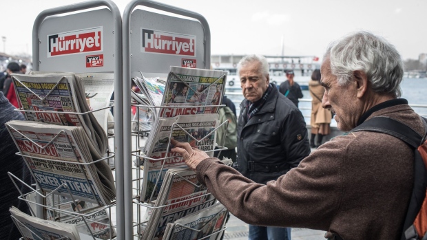 ISTANBUL, TURKEY - MARCH 23: A man looks at newspapers at a news stand on March 23, 2018 in Istanbul, Turkey. The Government of Turkish President Recep Tayyip Erdogan passed a new law on March 22 extending the reach of the country's radio and TV censor to the internet. The new law will allow RTUK, the states media watchdog, to monitor online broadcasts and block content of social media sites and streaming services including Netflix and YouTube. Turkey already bans many websites including Wikipedia, which has been blocked for more than a year. The move came a day after private media company Dogan Media Company announced it would sell to pro-government conglomerate Demiroren Holding AS. The Dogan news group was the only remaining news outlet not to be under government control, the sale, which includes assets in CNN Turk and Hurriyet Newspaper completes the governments control of the Turkish media. (Photo by Chris McGrath/Getty Images)