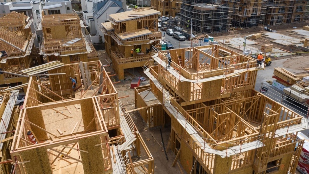 Contractors work on single-family homes under construction in the Cadence Park development of The Great Park Neighborhoods in Irvine, California.
