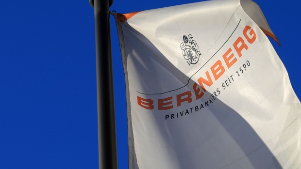 The Joh. Berenberg Gossler & Co. KG logo sits on a banner as it flies outside the Berenberg bank headquarters in Hamburg, Germany, on Tuesday, Feb. 27, 2018. About 130 years after leaving the U.S., Germany based lender Berenberg is pushing back to the other side of the Atlantic.