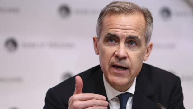 Mark Carney, governor of the Bank of England (BOE), gestures while speaking during a news conference at the central bank in the City of London, U.K., on Wednesday, March 11, 2020. The Bank of England cut interest rates in an emergency move and announced measures to help keep credit flowing through the economy, saying the coronavirus outbreak will damage economic activity.